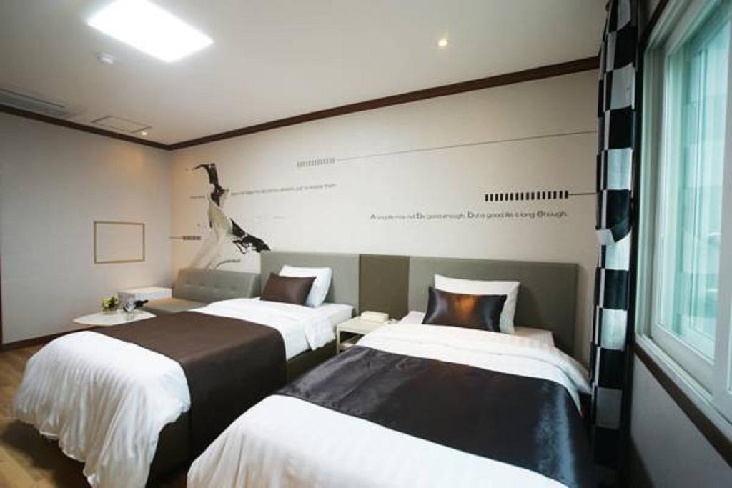 Seongsan Aqua Beach Hotel Seogwipo Quarto foto